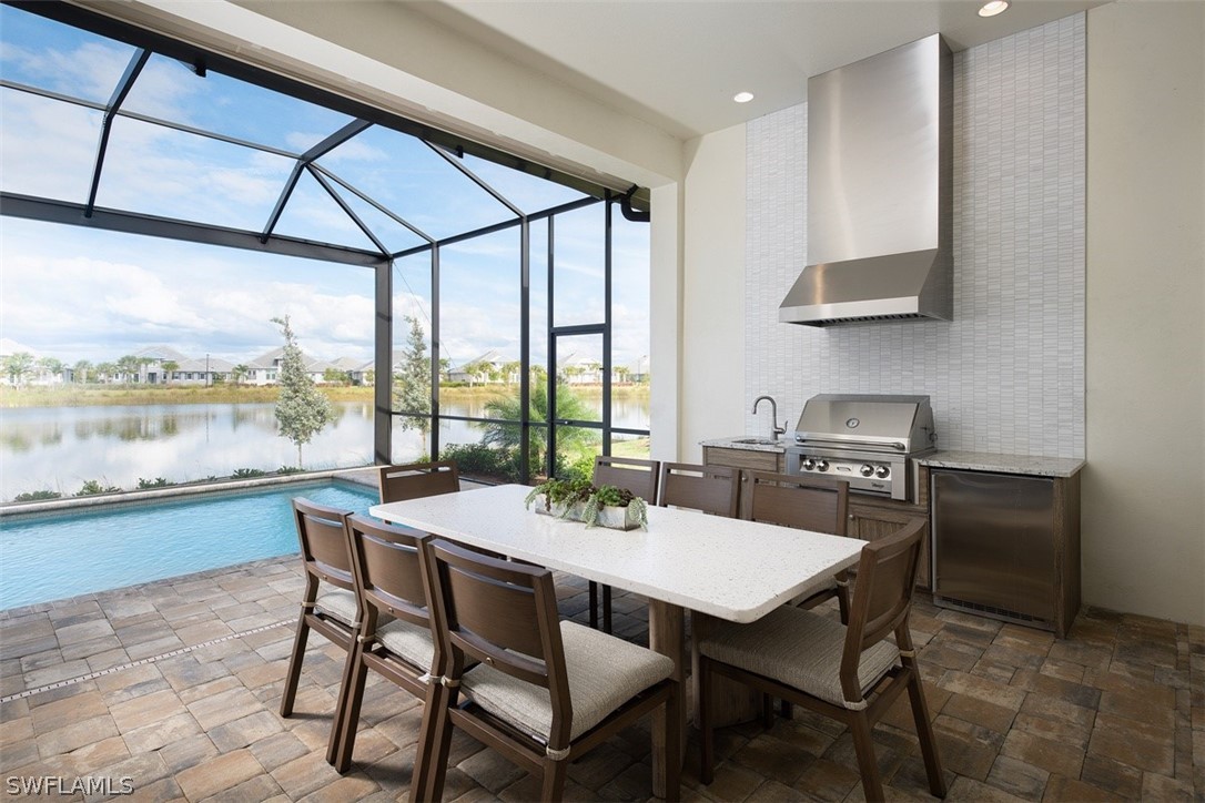 6181 Megans Bay Drive Naples, FL 34113 - Photo 15 of 32 a view of a dining room with furniture window and outside view