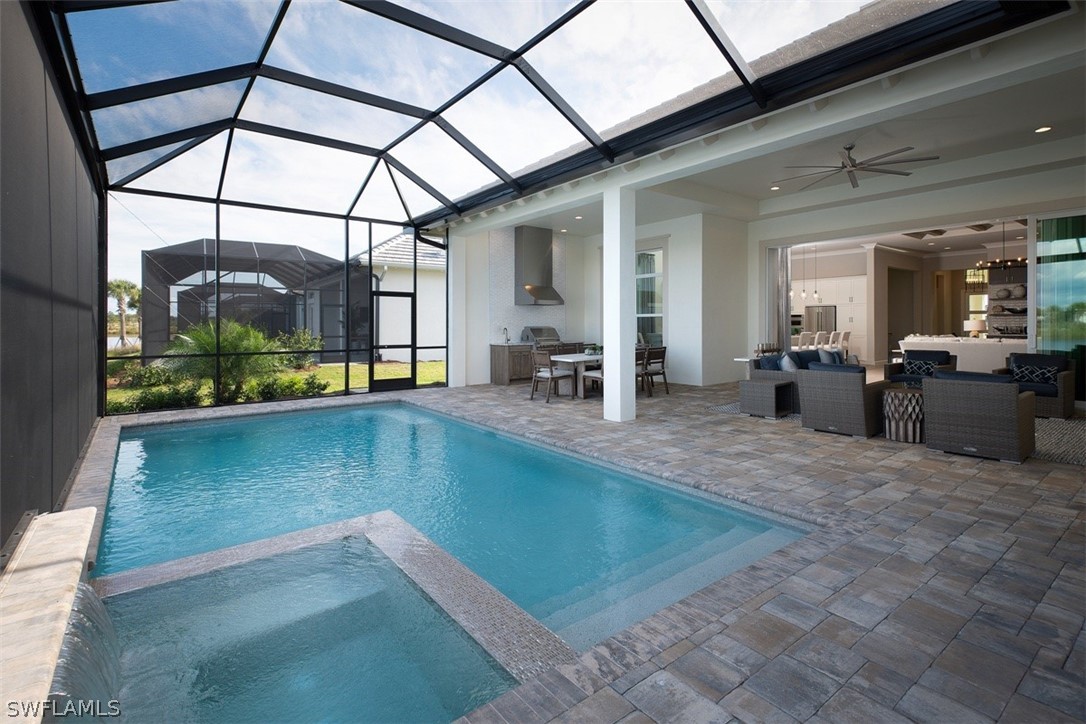 6181 Megans Bay Drive Naples, FL 34113 - Photo 18 of 32 a view of a living room and bathroom