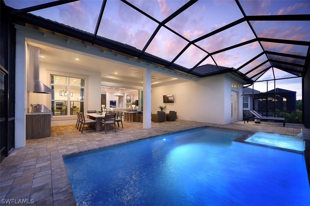 6181 Megans Bay Drive Naples, FL 34113 - Photo 19 of 32 a view of a livingroom with furniture and wooden floor