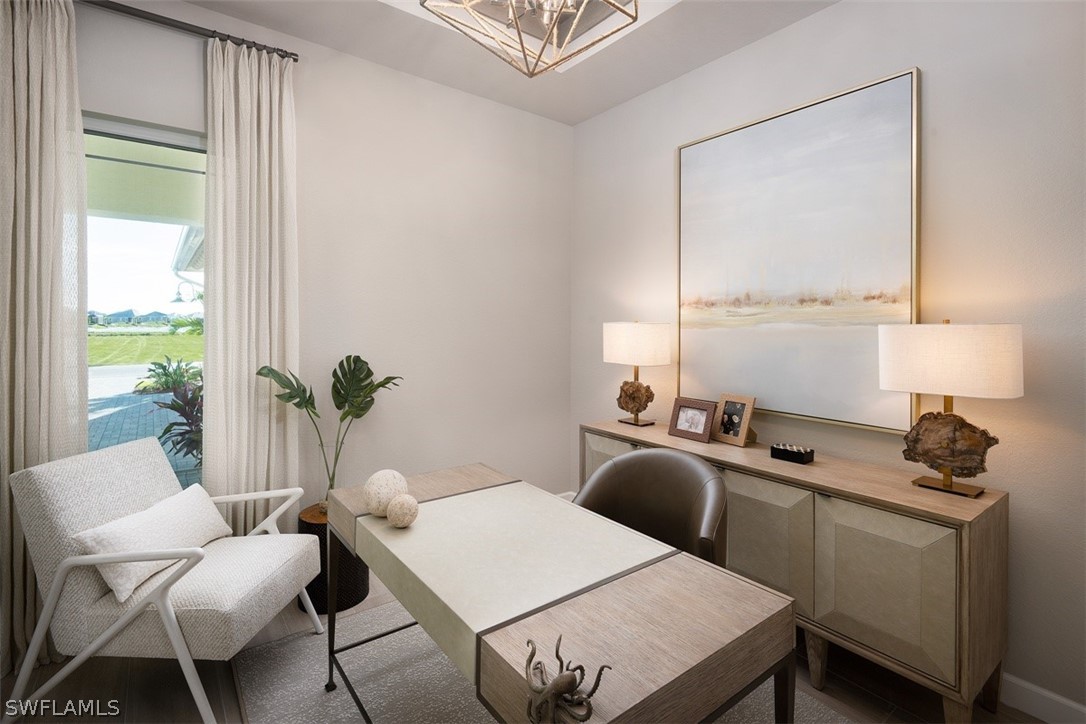 6181 Megans Bay Drive Naples, FL 34113 - Photo 21 of 32 a view of a dining room with furniture window and outside view