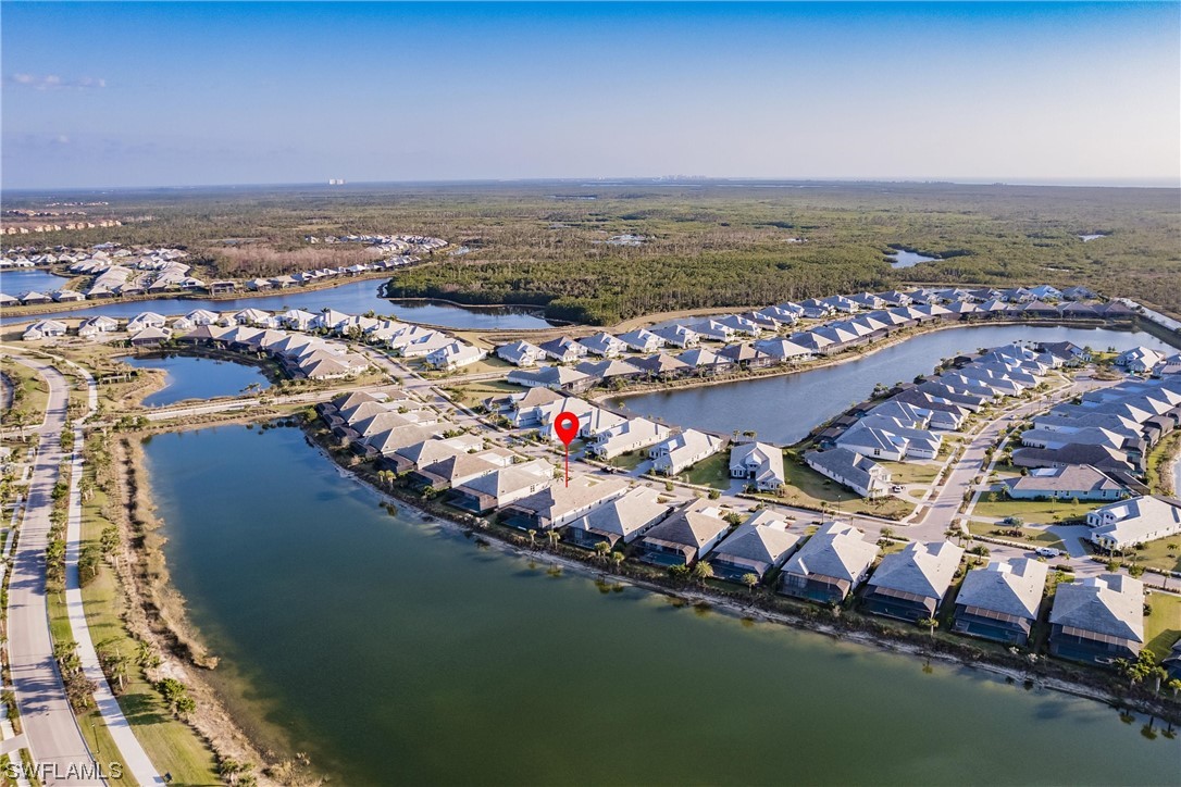 6181 Megans Bay Drive Naples, FL 34113 - Photo 25 of 32 an aerial view of residential houses with outdoor space