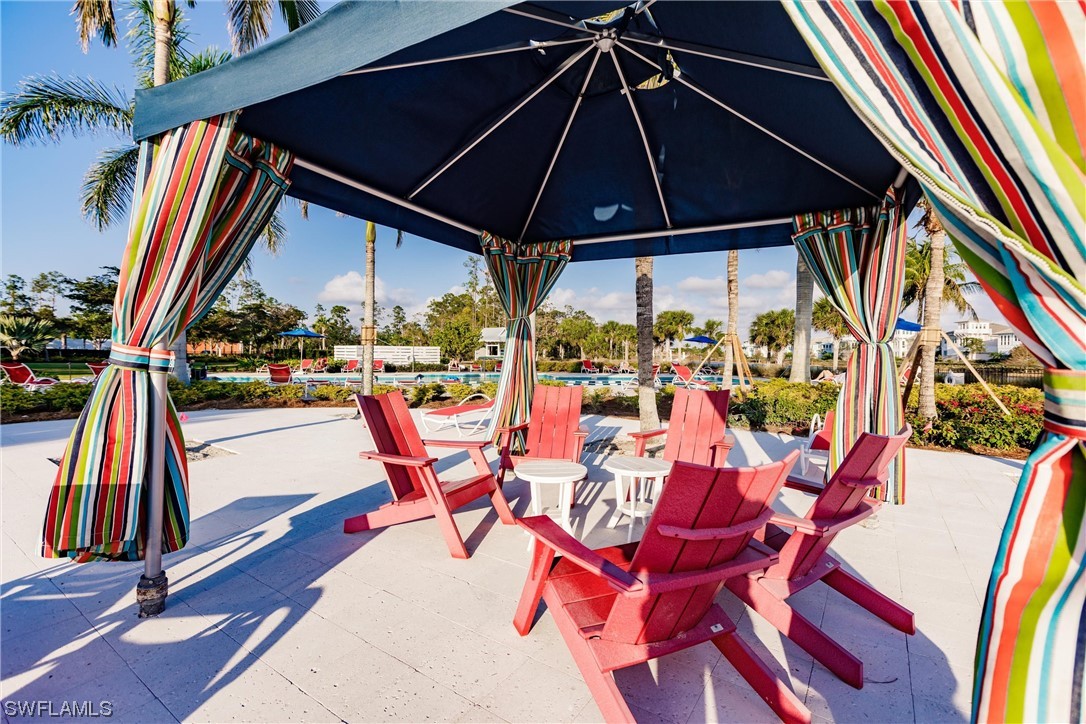 6181 Megans Bay Drive Naples, FL 34113 - Photo 29 of 32 a view of outdoor space with seating area