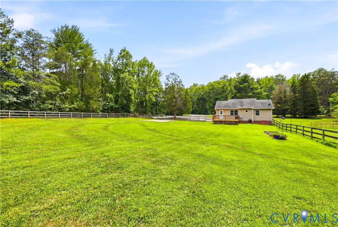 15490 Tyler Station Road Beaverdam, VA 23015 - Photo 12 of 45 Expansive green lawn with a perimeter fence, matur