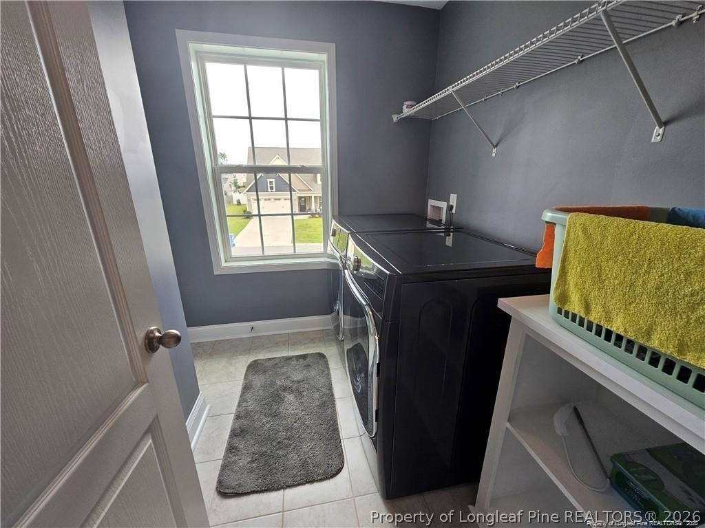 181 Pendleton Street Raeford, NC 28376 - Photo 12 of 19 a bathroom with a granite countertop sink a toilet and a window