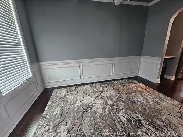 a view of a closet with wooden floor