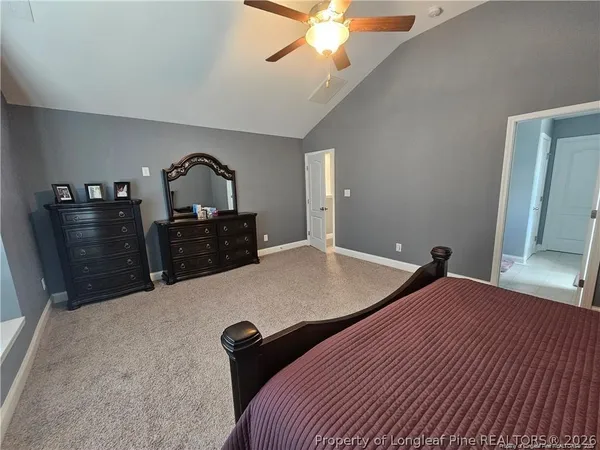 a bed room with a bed and a television