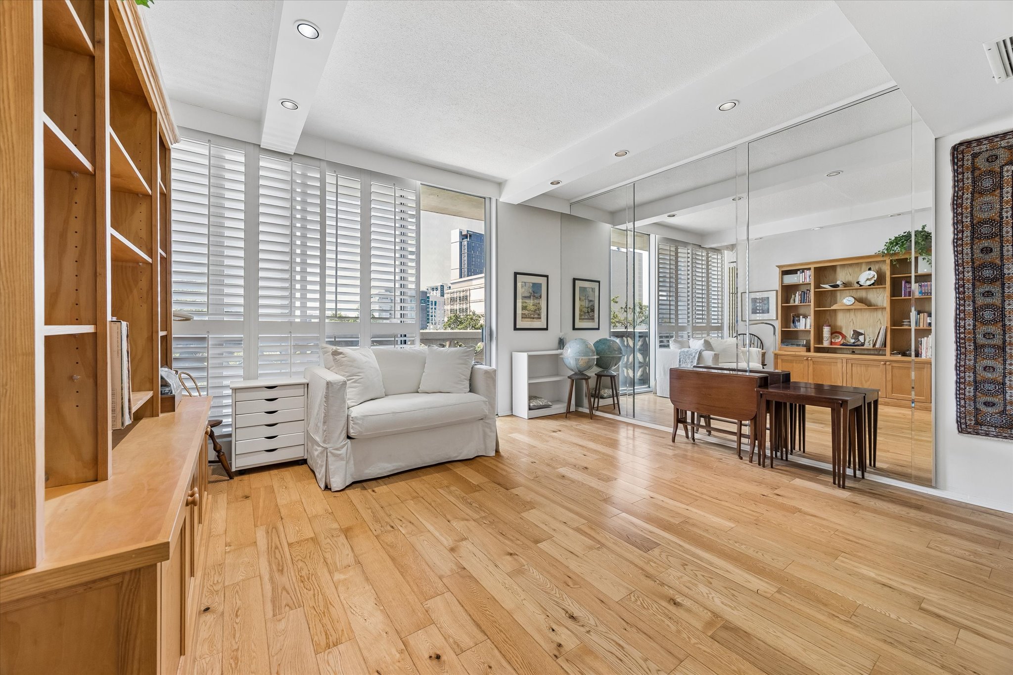 1801 Lavaca Street, Unit 3M Austin, TX 78701 - Photo 2 of 30 Living area with light wood-type flooring and recessed lighting