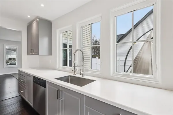 a kitchen with a sink and a window
