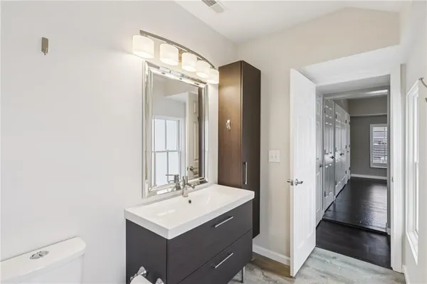 a bathroom with a sink a mirror and a shower