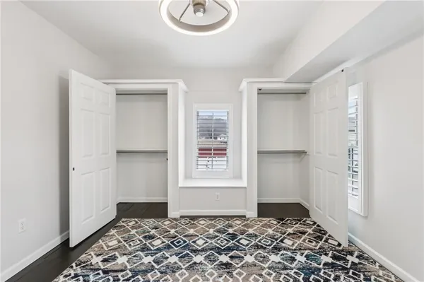 a view of a hallway with windows