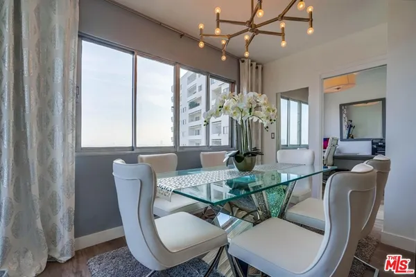 a view of a dining room with furniture window and outside view