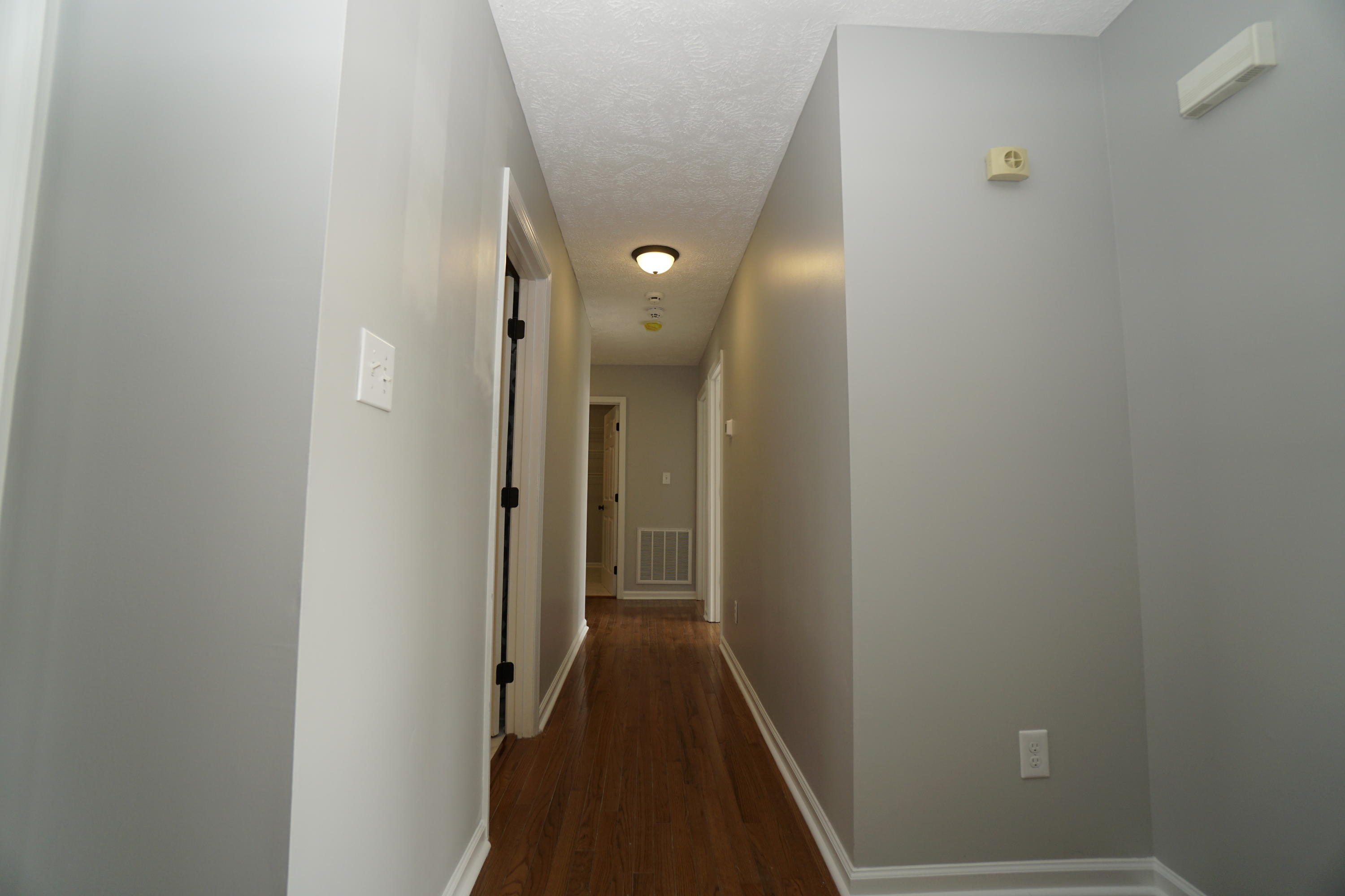 107 Cherian Court Pooler, GA 31322 - Photo 19 of 50 Full bath on left; two bedrooms on right; utility room ahead. Hallway and master around the corner.