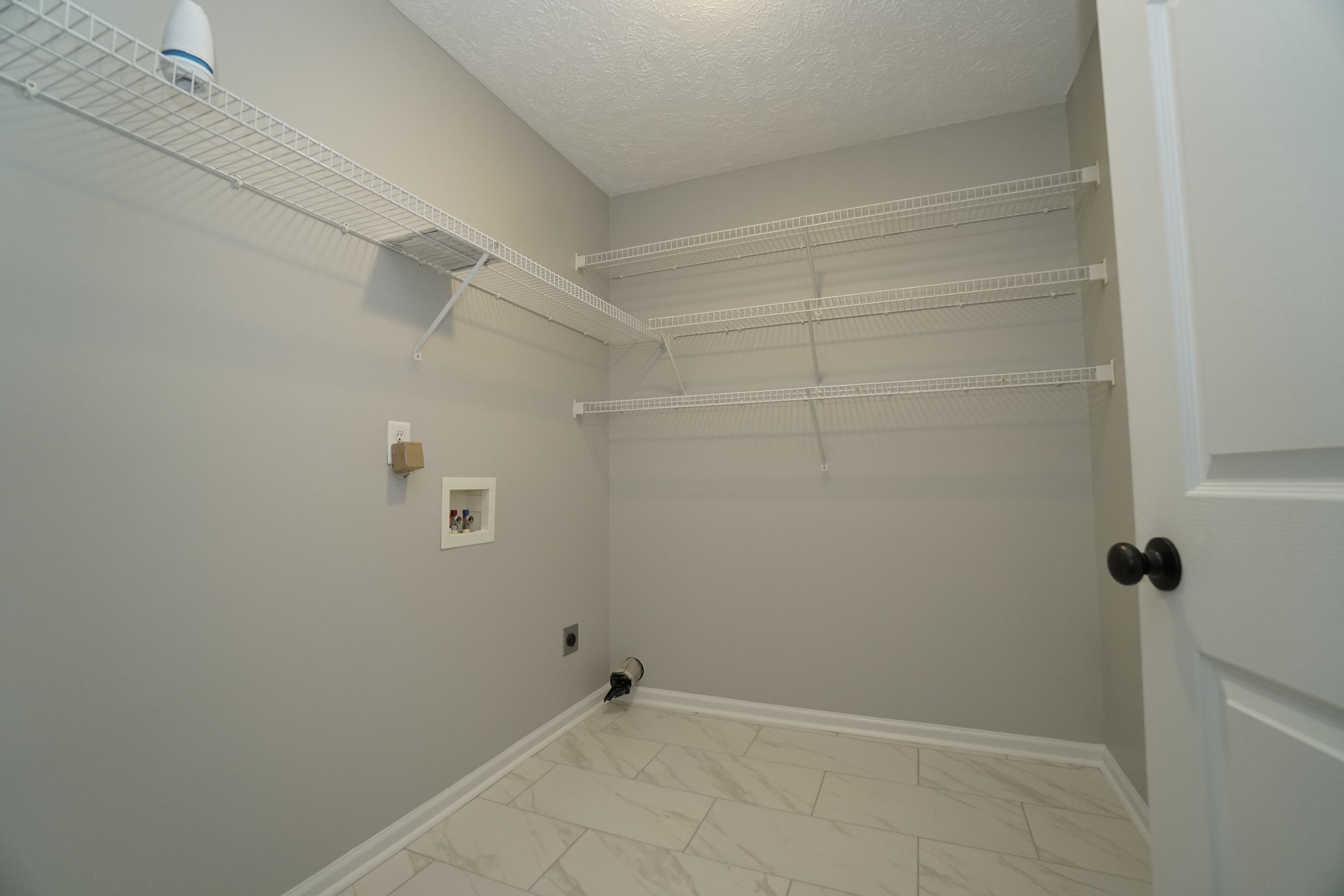 107 Cherian Court Pooler, GA 31322 - Photo 27 of 50 Large utility room with lots of storage shelves