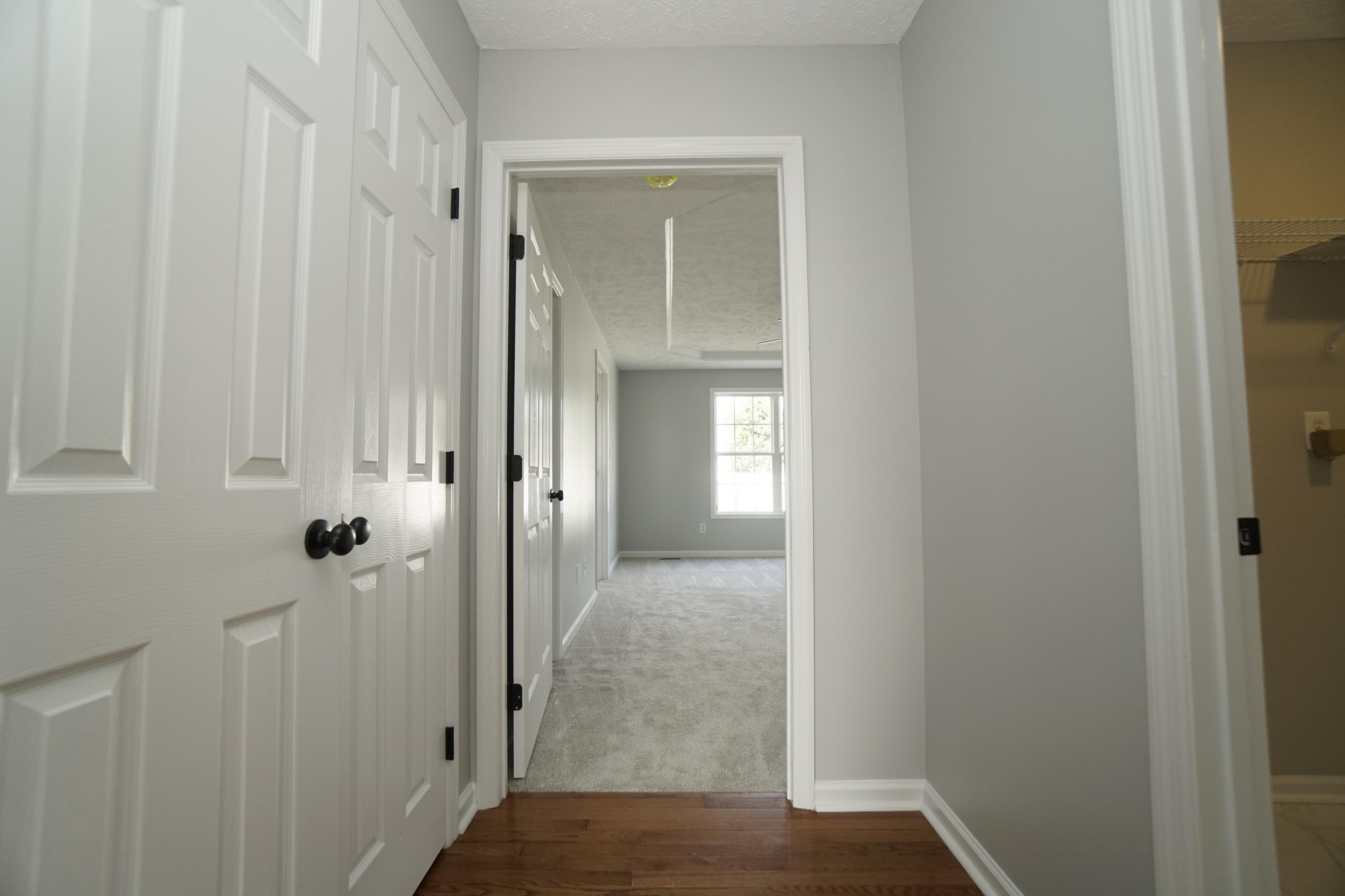 107 Cherian Court Pooler, GA 31322 - Photo 28 of 50 Large closet outside of utility room and hallway leads to master bedroom