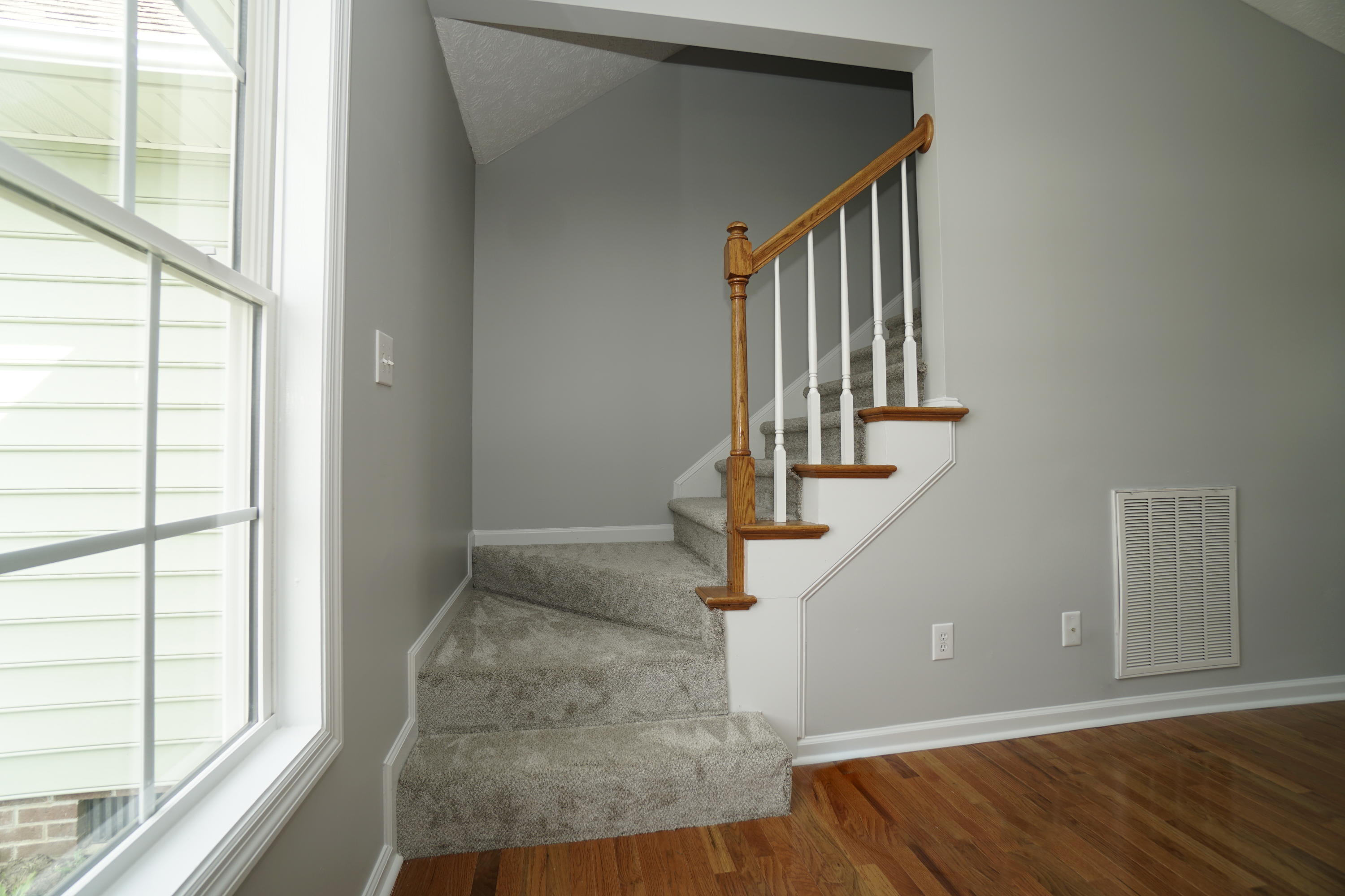 107 Cherian Court Pooler, GA 31322 - Photo 39 of 50 The stairs to the 4th bedroom/bonus room are off the living room.