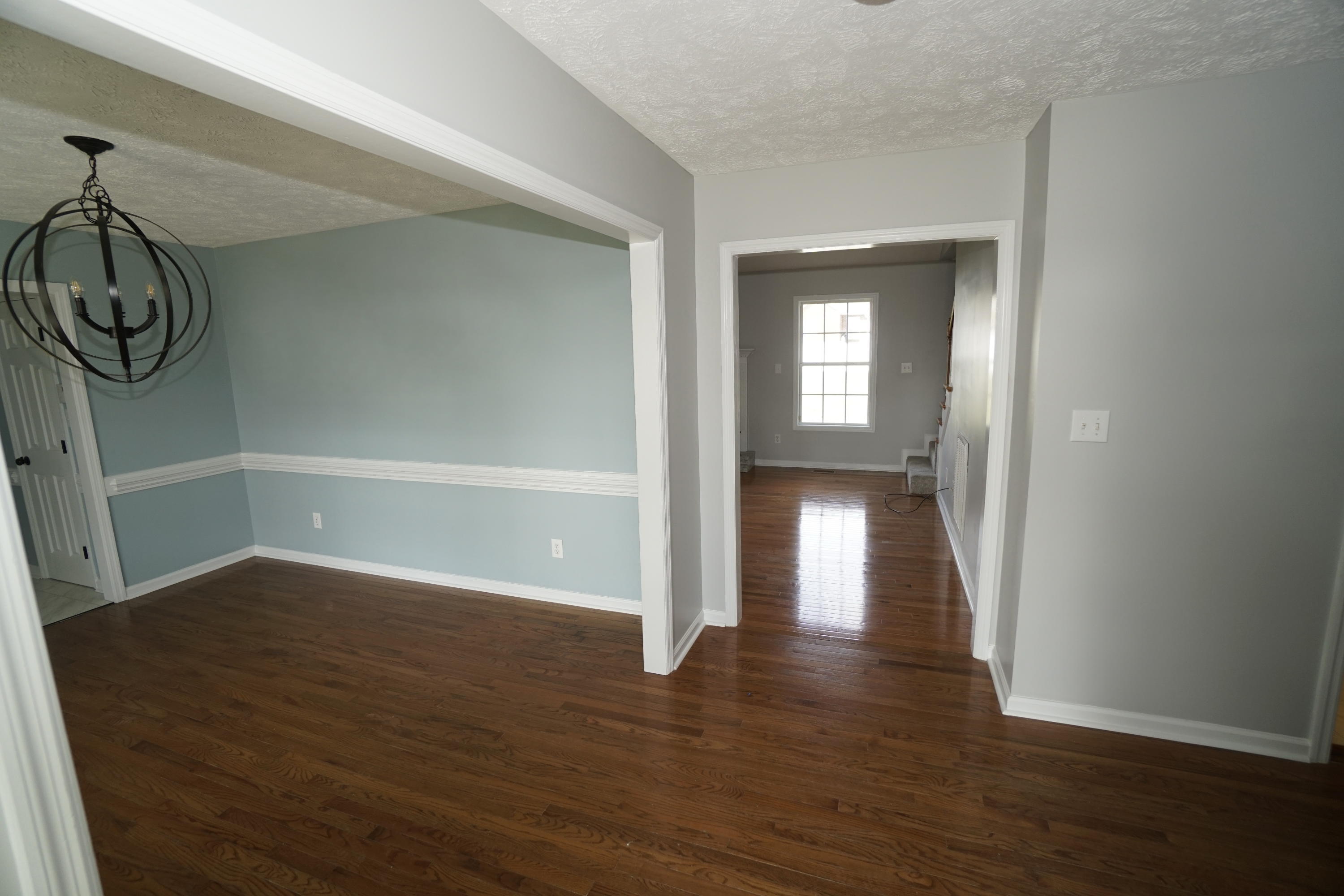 107 Cherian Court Pooler, GA 31322 - Photo 5 of 50 Once inside, the dining room is to the left, the living room straight ahead. Hallway to bedrooms to the right. Coat closet behind entry door.