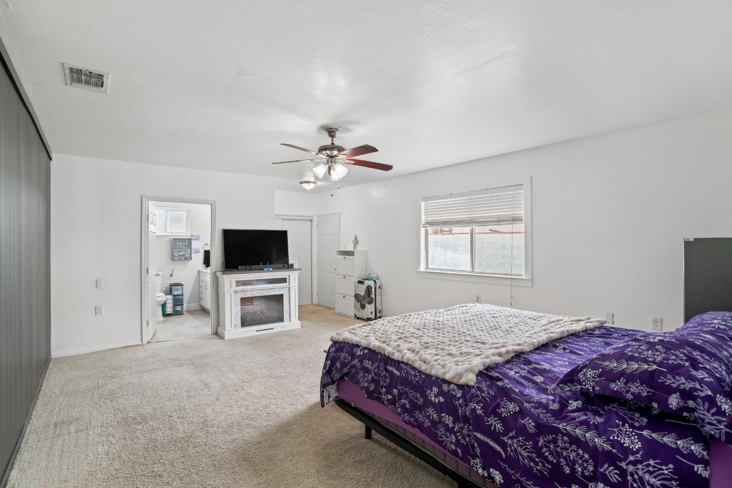 832 Jackson Street Winters, CA 95694 - Photo 16 of 41 carpeted bedroom with a ceiling fan and ensuite bath