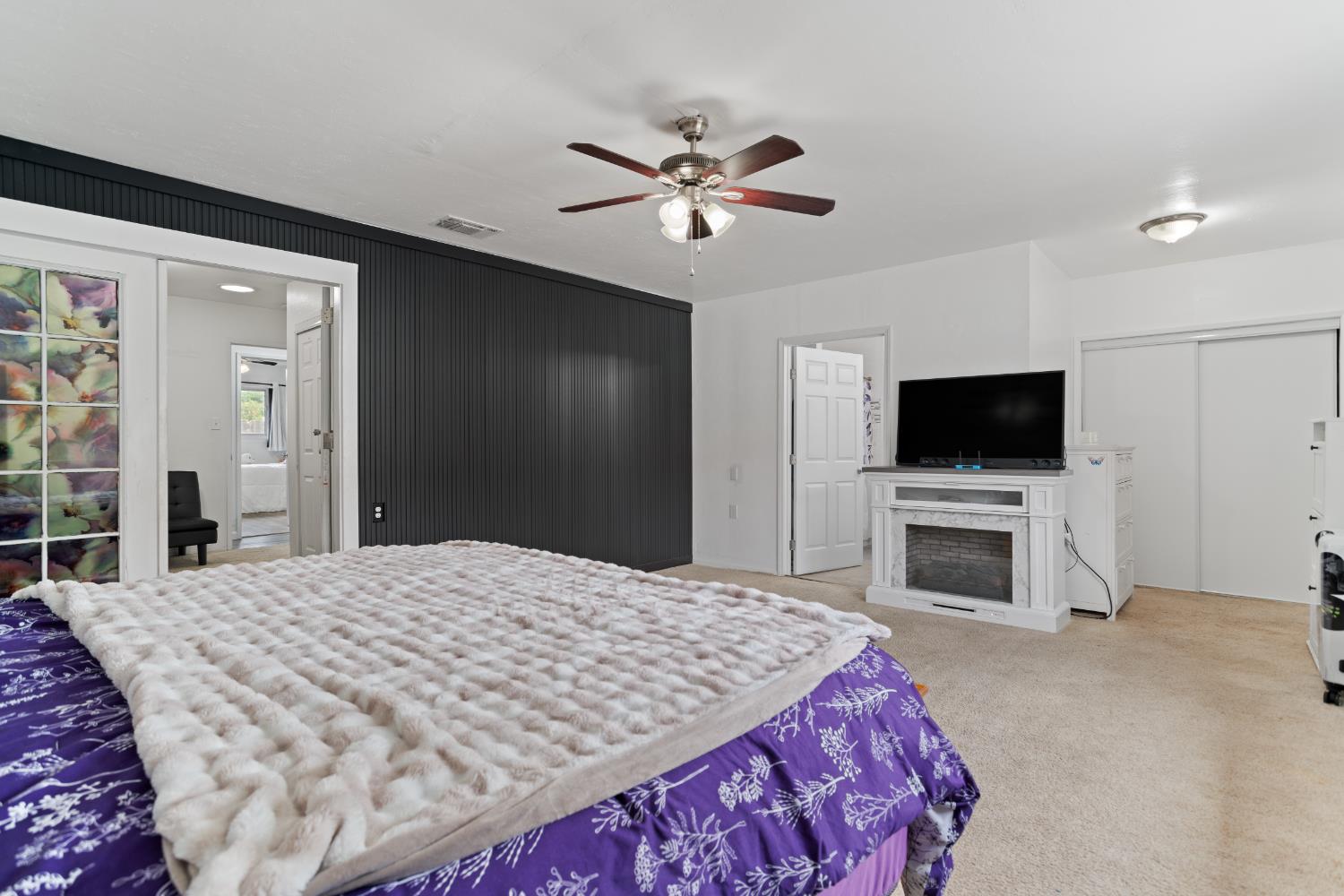 832 Jackson Street Winters, CA 95694 - Photo 17 of 41 bedroom with light carpet, a closet, and a ceiling fan