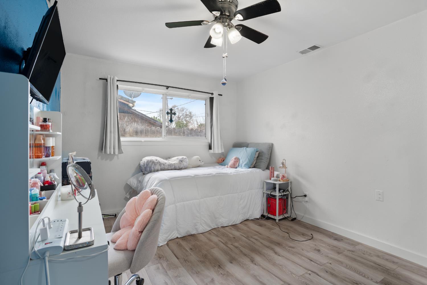 832 Jackson Street Winters, CA 95694 - Photo 22 of 41 bedroom with light wood-style floors and a ceiling fan