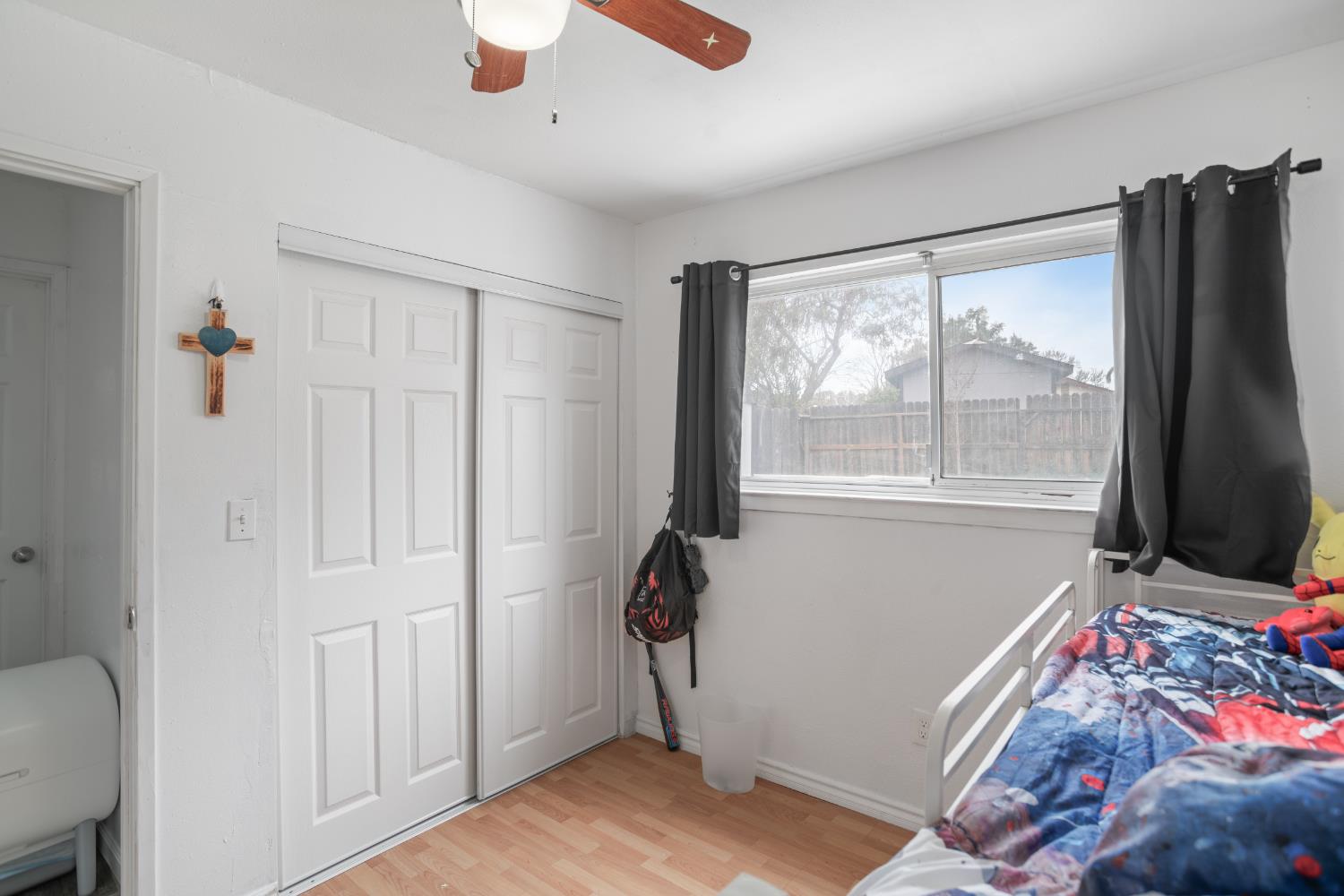 832 Jackson Street Winters, CA 95694 - Photo 28 of 41 bedroom featuring light wood-type flooring, a closet, and a ceiling fan