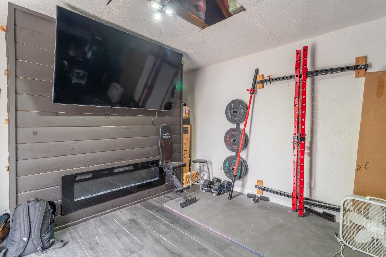 832 Jackson Street Winters, CA 95694 - Photo 31 of 41 workout room with a textured ceiling and wood finished floors