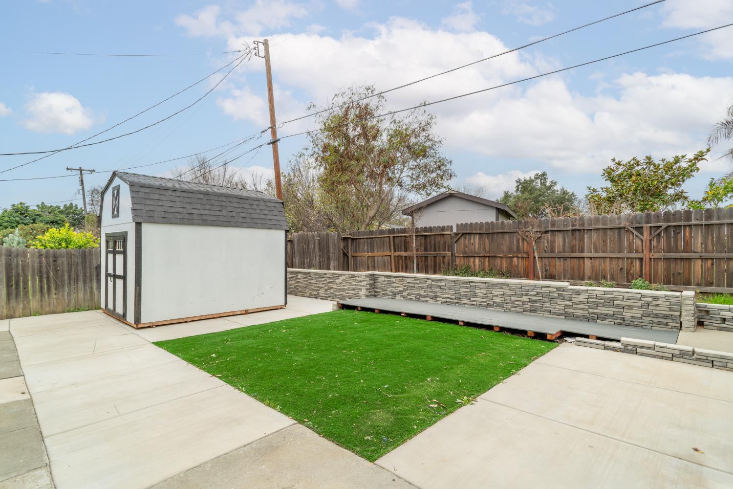 832 Jackson Street Winters, CA 95694 - Photo 38 of 41 fenced backyard featuring a storage unit and a patio area