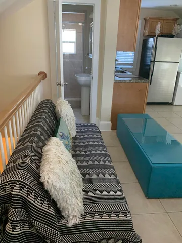 a bedroom with a bed and a mirror