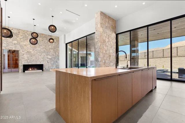 a view of an empty room with a fireplace