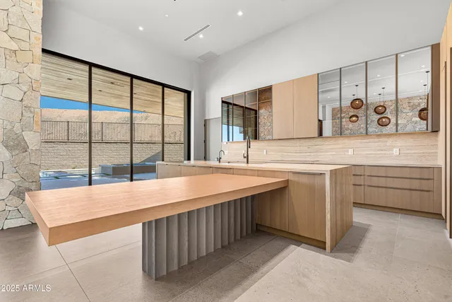 a bedroom with a bed and a fireplace