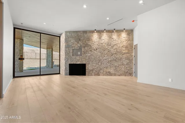 a living room with a couch and a large window