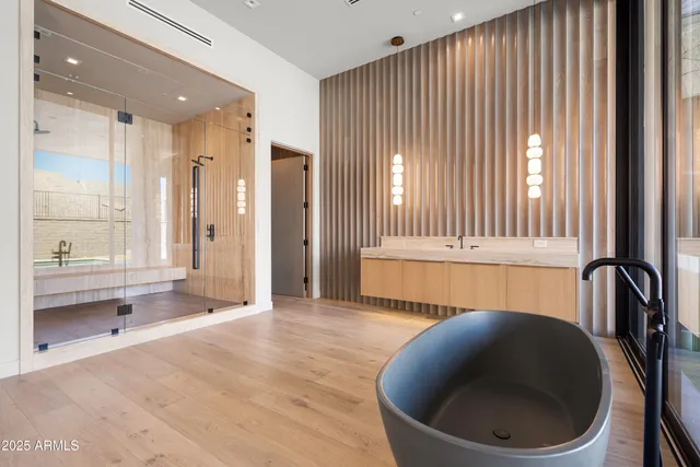 a view of an empty room with a ceiling fan