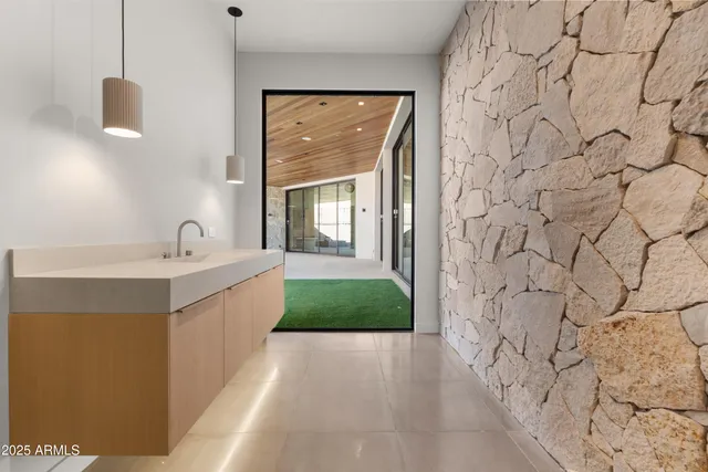 a view of a patio with couches and table with potted plants