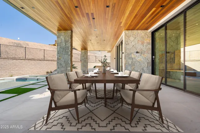 a row of palm trees in front of a building