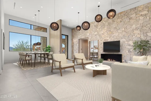 a view of a livingroom with furniture and a large window