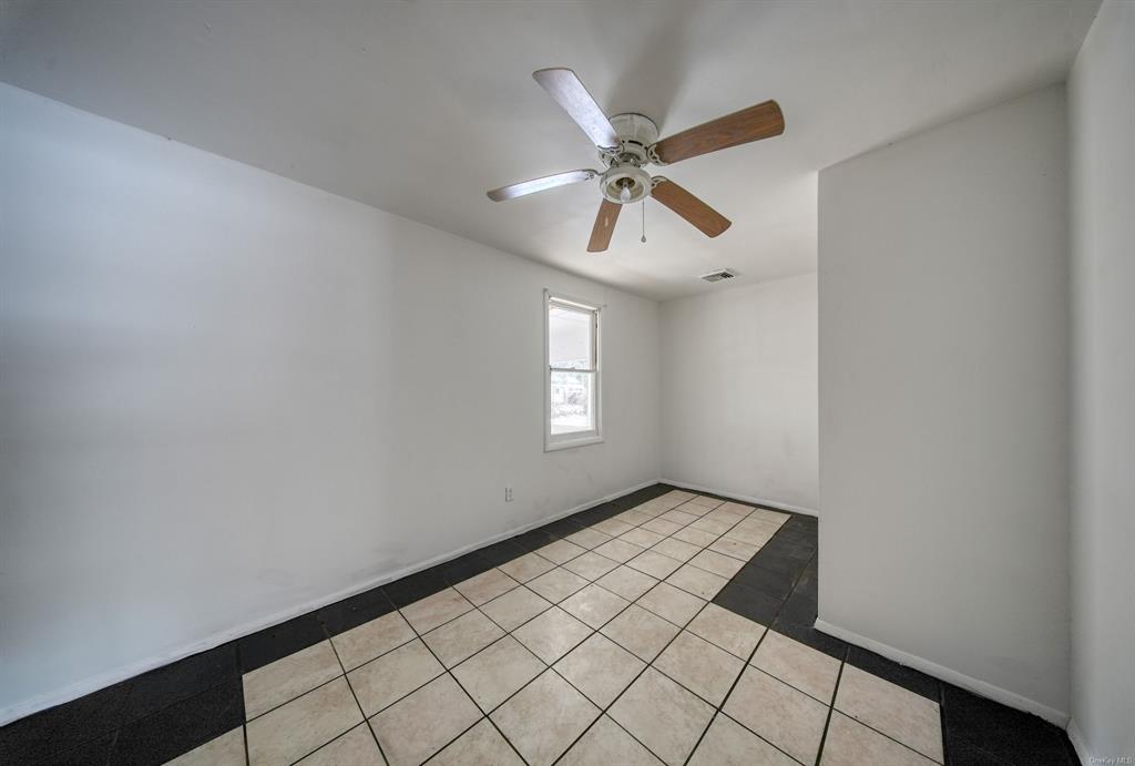 3 Avenue Godeffroy, NY 12729 - Photo 13 of 24 Empty room featuring ceiling fan and light tile patterned flooring