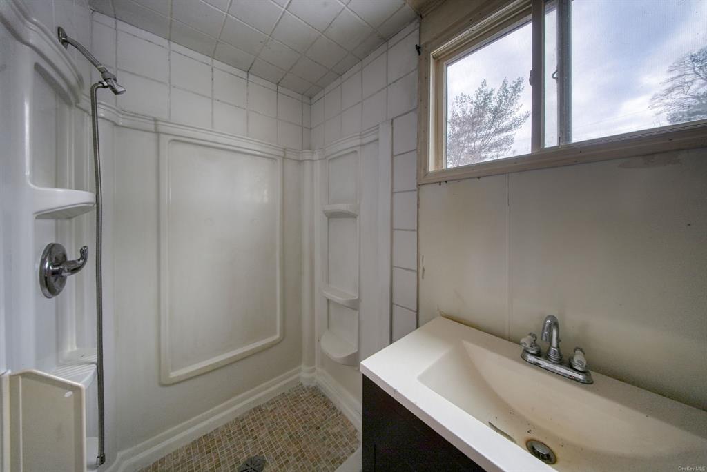 3 Avenue Godeffroy, NY 12729 - Photo 16 of 24 Bathroom featuring a shower, vanity, and tile patterned flooring
