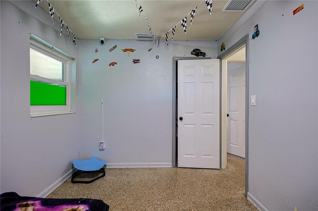 613 Scenic Street Leesburg, FL 34748 - Photo 19 of 38 a view of a hallway with closet and window