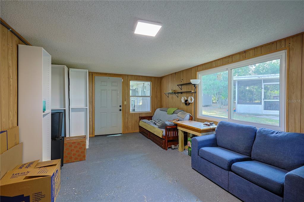 613 Scenic Street Leesburg, FL 34748 - Photo 21 of 38 a living room with furniture and a window