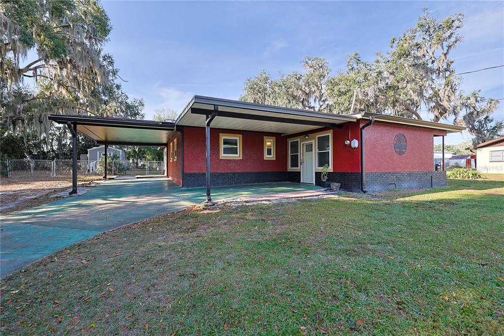 613 Scenic Street Leesburg, FL 34748 - Photo 29 of 38 a front view of a house with a yard