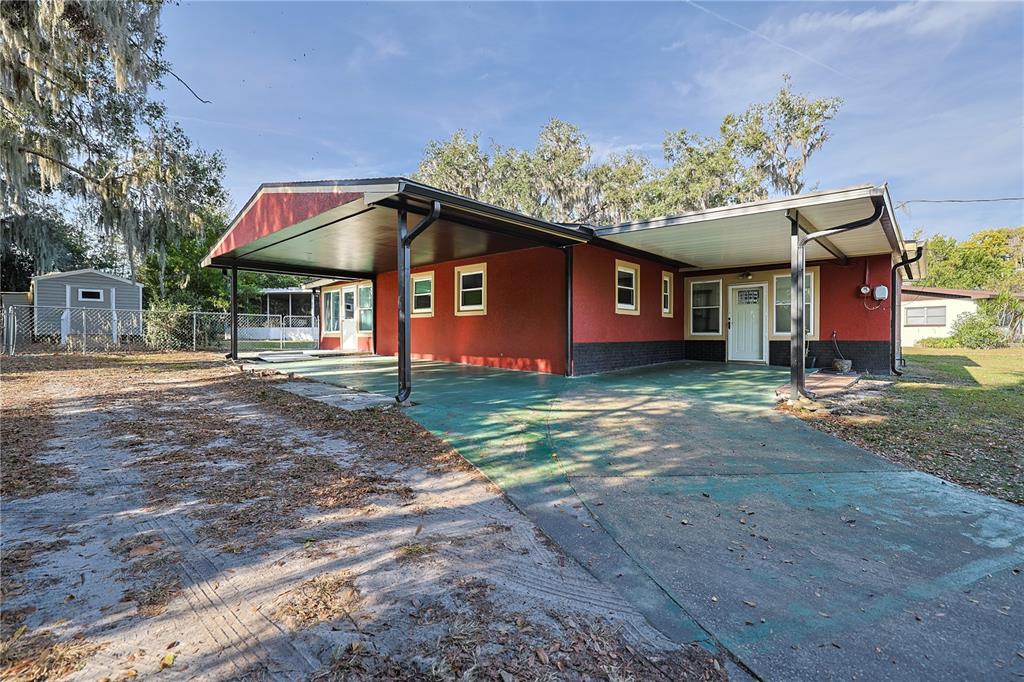 613 Scenic Street Leesburg, FL 34748 - Photo 30 of 38 a front view of a house with a yard