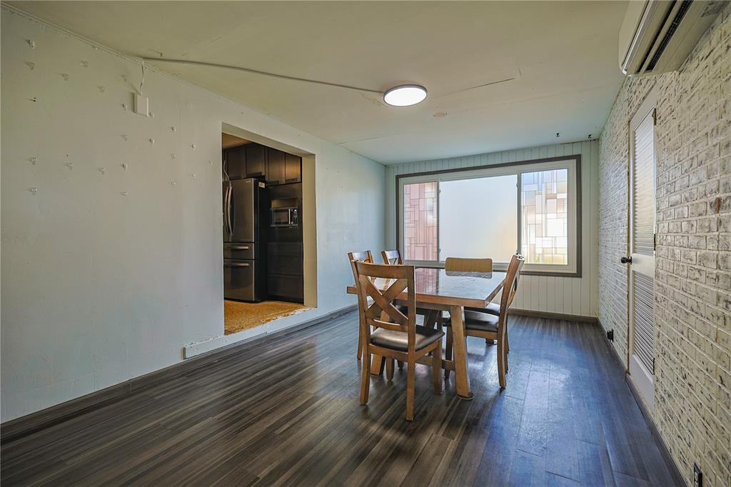 613 Scenic Street Leesburg, FL 34748 - Photo 3 of 38 a view of a dining room with furniture and wooden floor