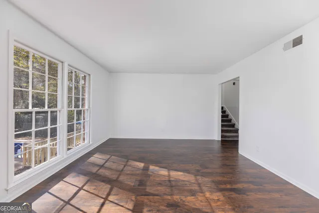 a view of empty room with windows