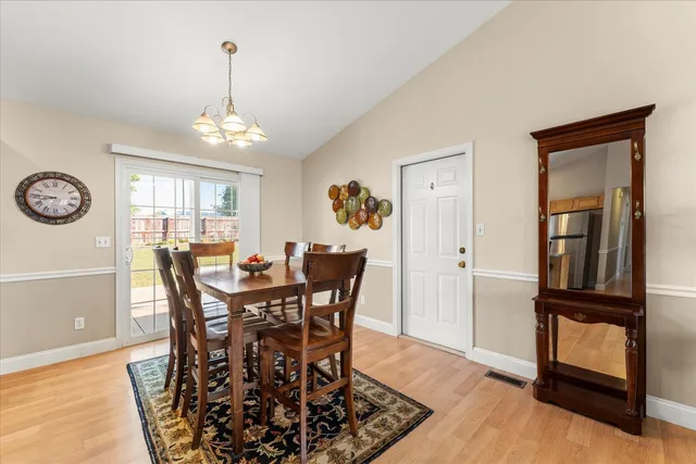 a view of a dining room with furniture and window