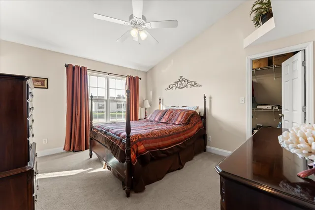 a bed sitting in a room next to a window