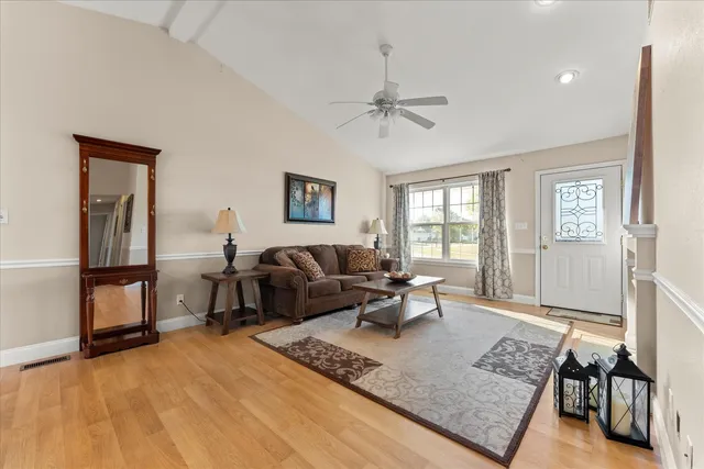 a living room with furniture rug and window
