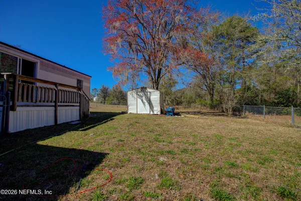 a view of back yard of the house