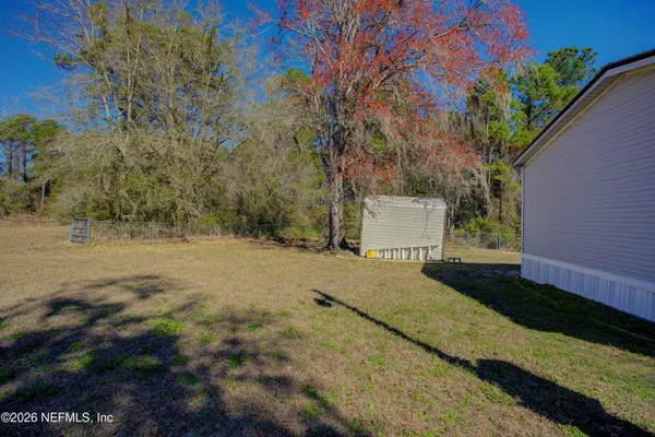 a aerial view of a house with a yard