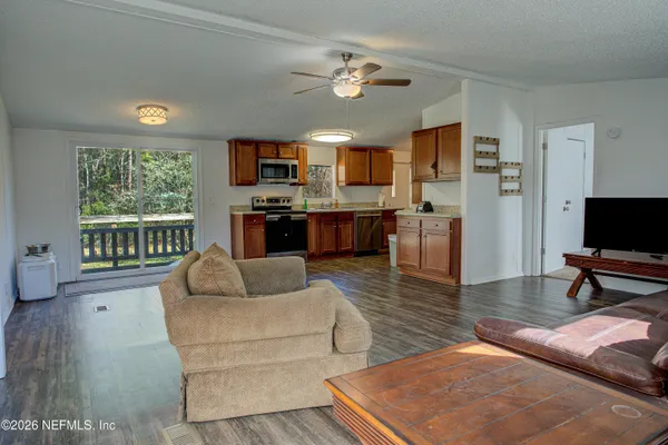 a living room with furniture and a flat screen tv