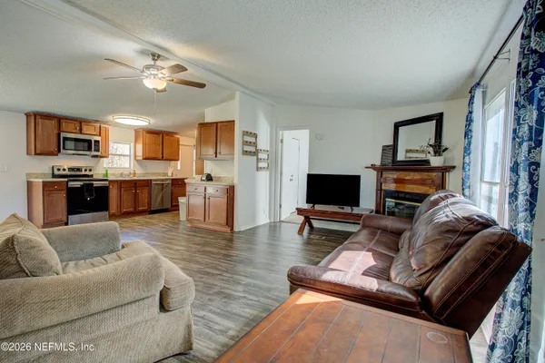 a living room with furniture and a flat screen tv