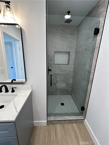 a bathroom with a shower and a toilet